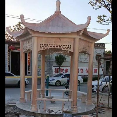 村庄文化中心摆放晚霞红休闲石凉亭 