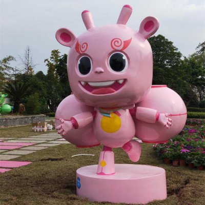 园林户外玻璃钢卡通粉色小怪兽雕塑 卡通雕塑作品团队家具城犀牛