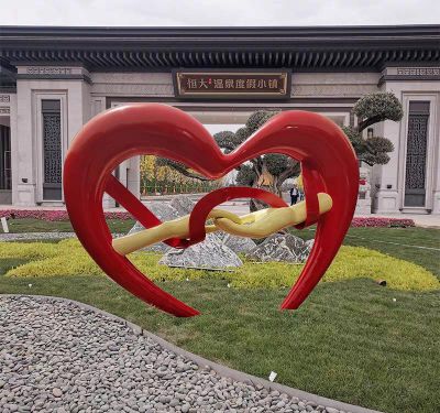 度假小镇创意手拉手玻璃钢爱心雕塑 爱心雕塑不锈钢戒指电话大型